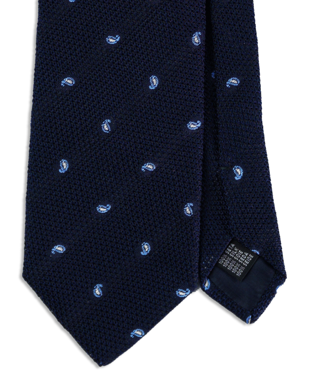 Nahaufnahme der Grenadine-Webart mit Paisley-Tropfen auf dunkelblauer Seidenkrawatte